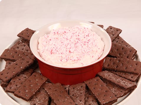 Peppermint Bark Dip in a red bowl